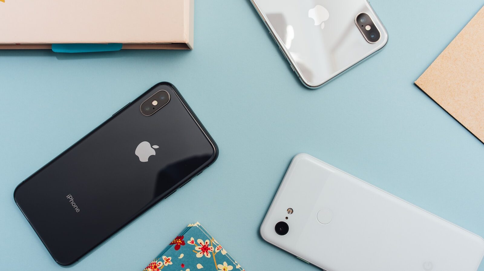 space gray iPhone X on blue surface